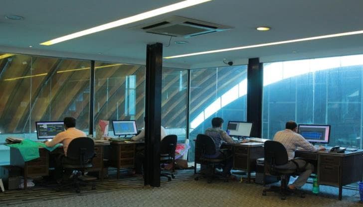 Technical apparel team working at computer workstations