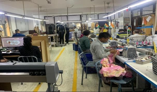 Garment development and sewing workspace with production staff
